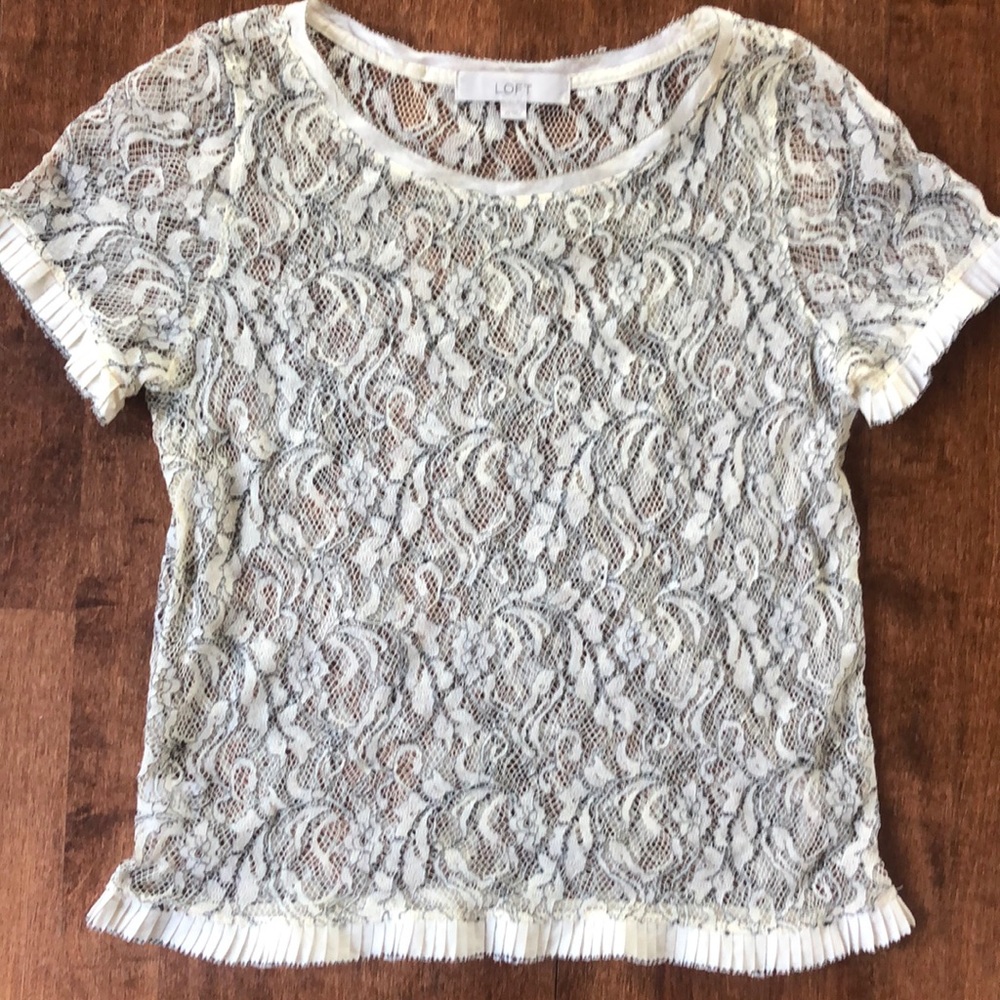Fun top with black and light cream detail